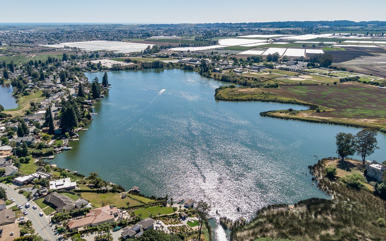 Aerial view of Watsonville California neighborhoods surrounding Pajaro Valley Lake in Santa Cruz County, illustrating the diverse housing areas and real estate market conditions across Santa Cruz County communities.